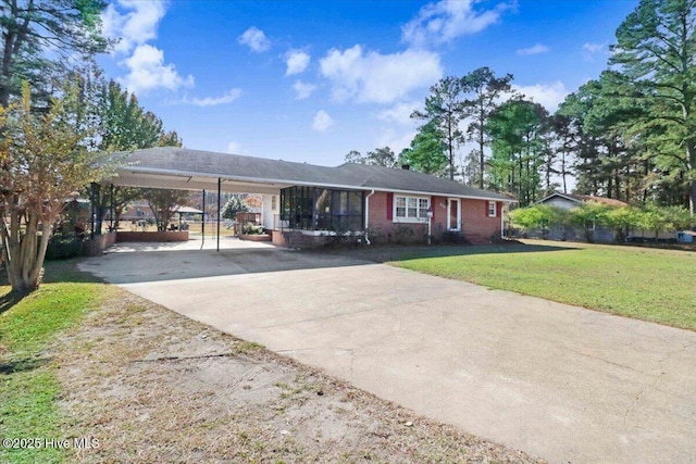 ranch-style home with a front lawn and a carport