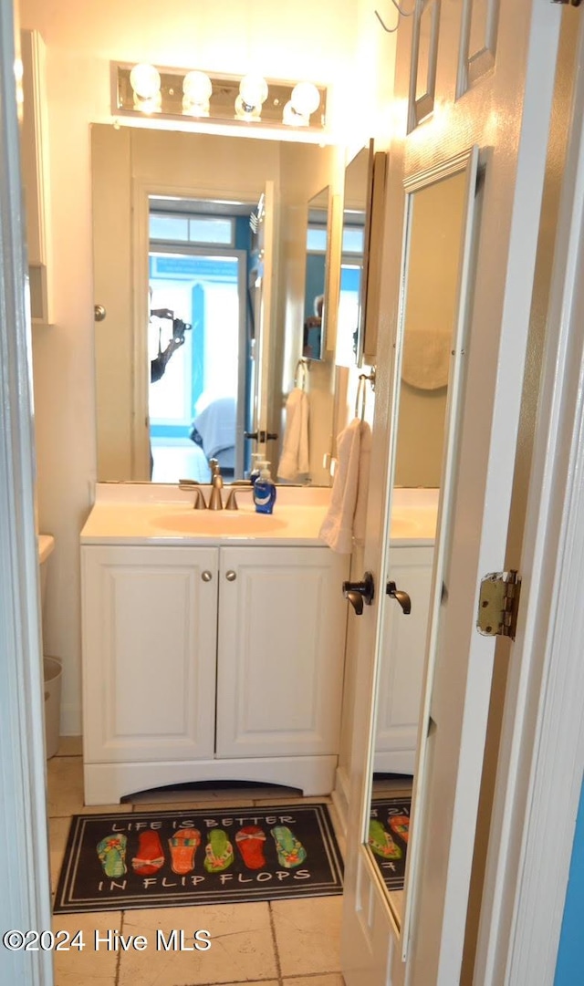 bathroom featuring tile patterned floors and vanity