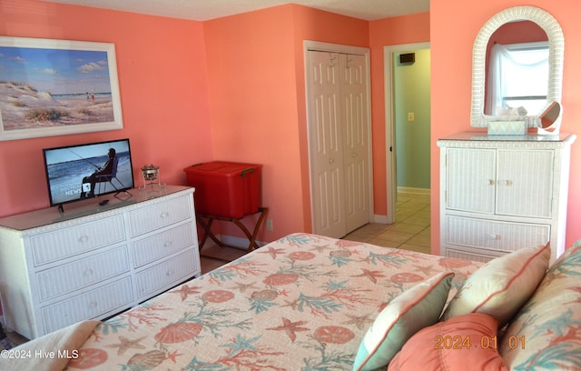 bedroom with light tile patterned floors