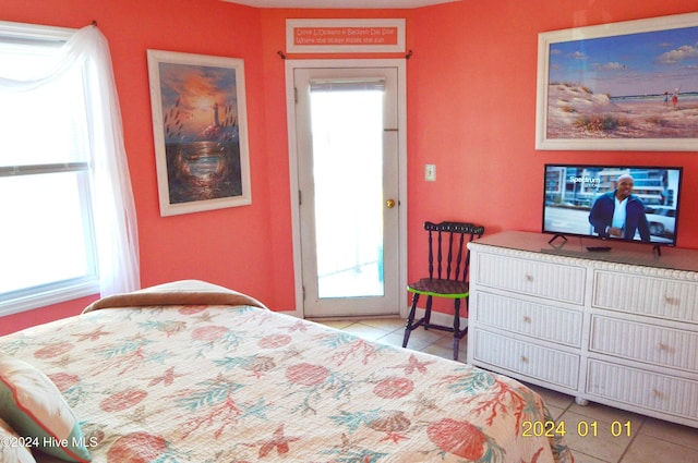 tiled bedroom with multiple windows