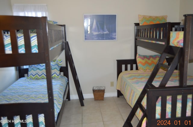 bedroom featuring light tile patterned floors