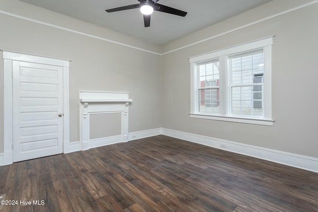 unfurnished room featuring dark hardwood / wood-style flooring and ceiling fan