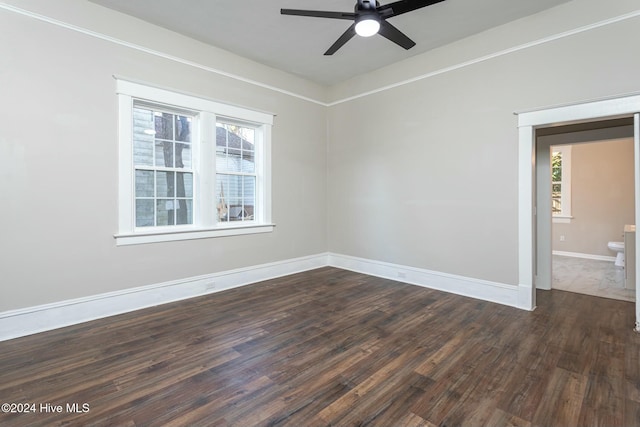 spare room featuring dark hardwood / wood-style floors and ceiling fan