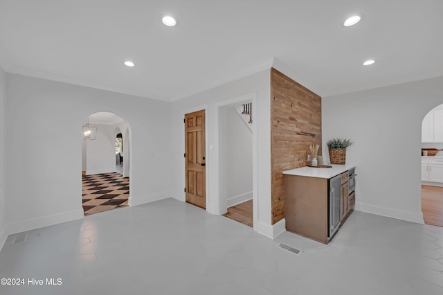 corridor with wooden walls and light hardwood / wood-style flooring