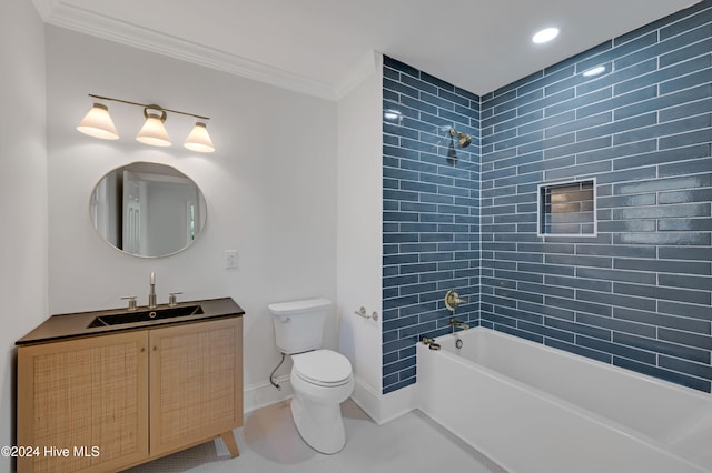 full bathroom with tiled shower / bath combo, toilet, crown molding, and vanity