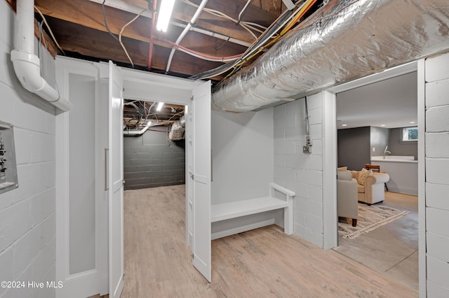 basement with wood-type flooring