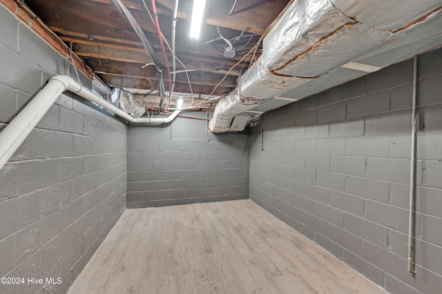 basement featuring hardwood / wood-style flooring