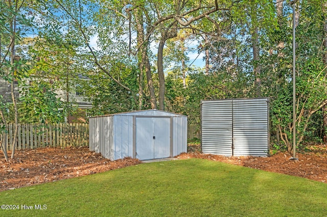 view of outbuilding featuring a yard