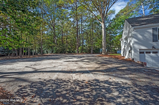 view of yard featuring a garage