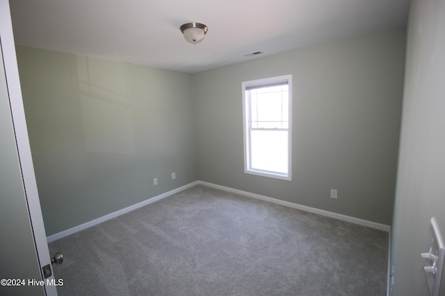 empty room featuring carpet floors