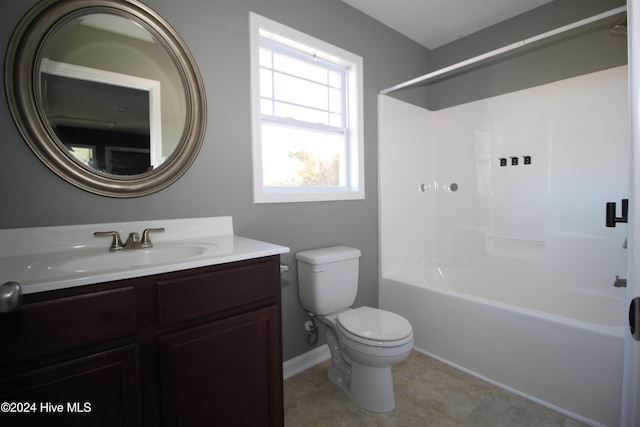 full bathroom with tile patterned flooring, vanity, bathing tub / shower combination, and toilet