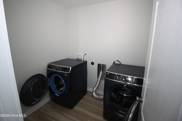 washroom featuring wood-type flooring and washer / dryer