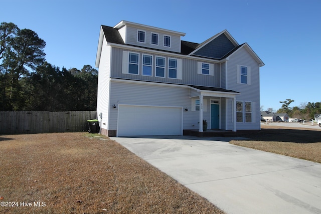 front of property with a garage and a front yard