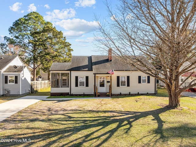 ranch-style home with a front yard