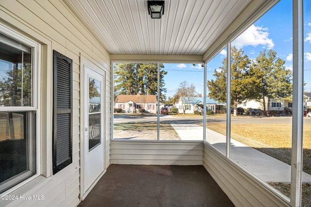 unfurnished sunroom with plenty of natural light