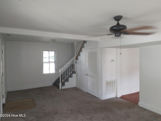 interior space with ceiling fan