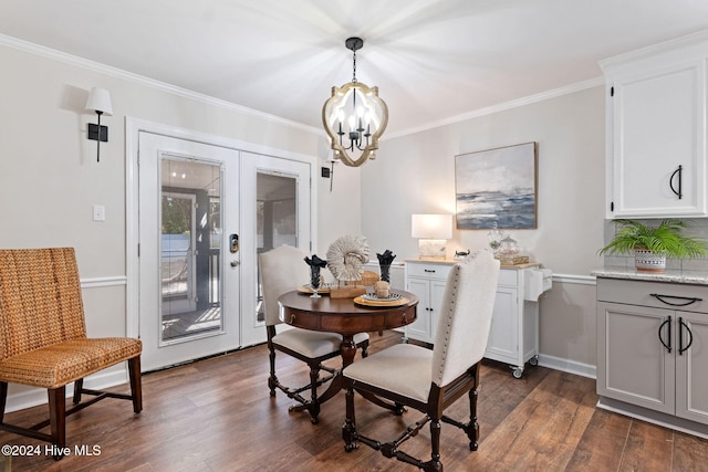 dining room with an inviting chandelier, ornamental molding, dark wood finished floors, and french doors