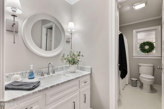 bathroom featuring ornamental molding, vanity, and toilet