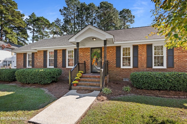 ranch-style house with a front lawn