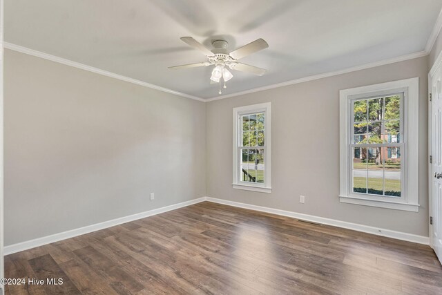 spare room featuring crown molding, ceiling fan, and dark hardwood / wood-style floors