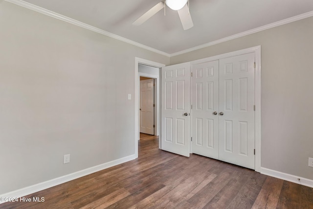 unfurnished bedroom with hardwood / wood-style flooring, ceiling fan, ornamental molding, and a closet