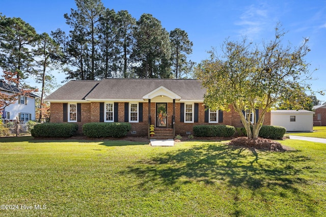 ranch-style home with a front lawn