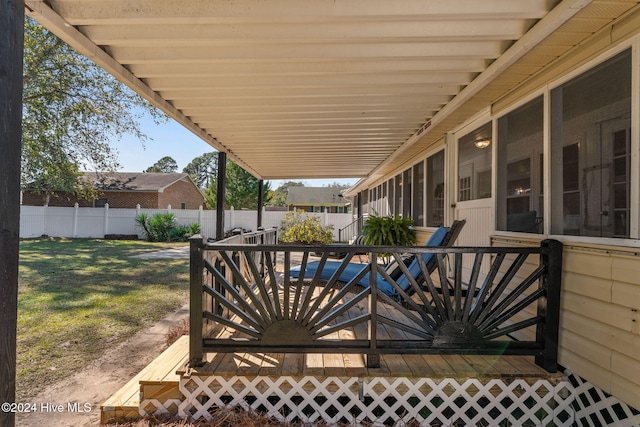 view of patio featuring a sunroom