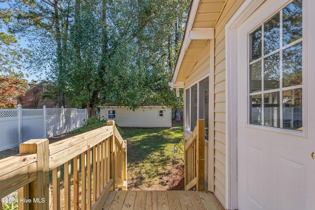 deck featuring a lawn