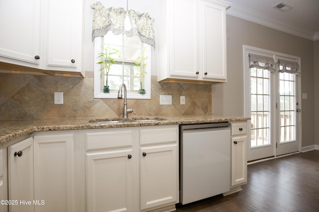 kitchen with dishwasher, white cabinets, sink, light stone countertops, and plenty of natural light