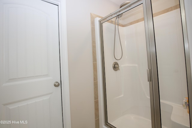 bathroom featuring an enclosed shower