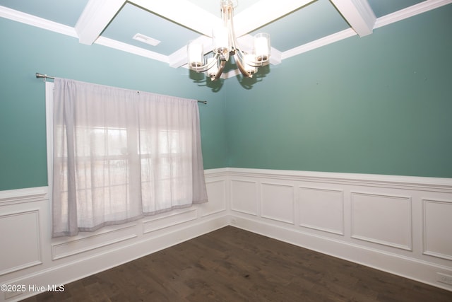 unfurnished room featuring beamed ceiling, dark wood-type flooring, crown molding, and an inviting chandelier