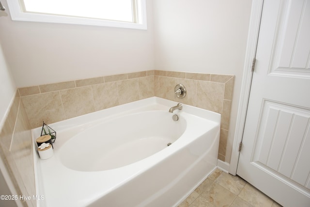 bathroom featuring a bathing tub and tile patterned flooring