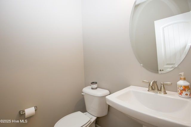 bathroom featuring sink and toilet