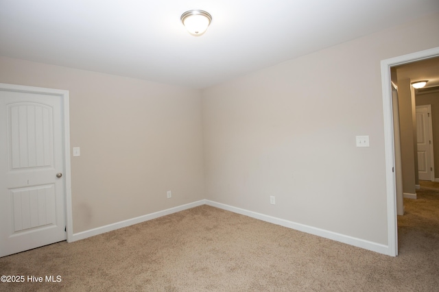 unfurnished room featuring carpet flooring