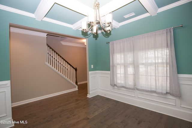 interior space featuring beamed ceiling, ornamental molding, and an inviting chandelier