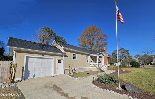 single story home featuring a front yard and a garage