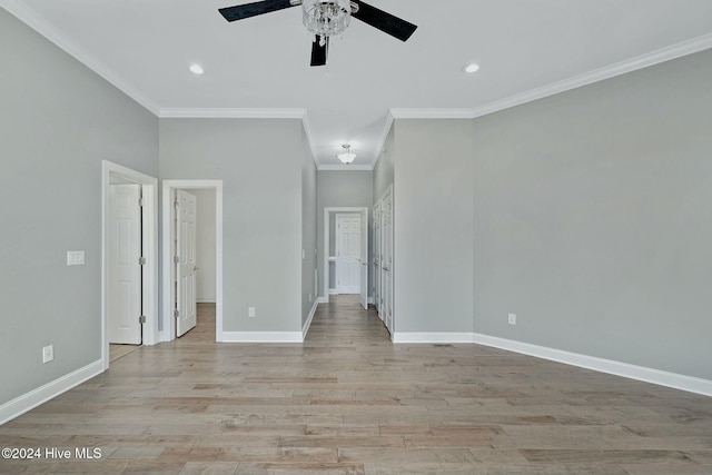 unfurnished room with crown molding, ceiling fan, and light hardwood / wood-style floors