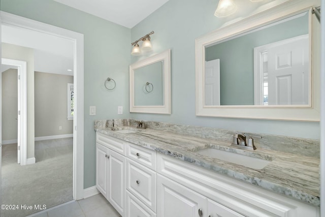 bathroom with tile patterned flooring and vanity