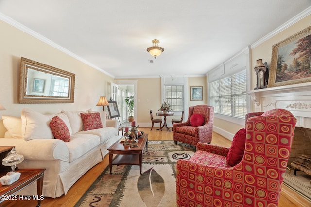 living room with light wood-type flooring and ornamental molding