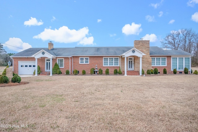 ranch-style home featuring a garage and a front yard