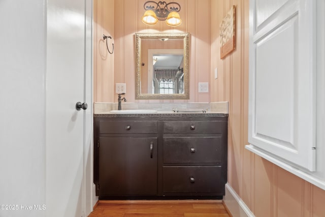 bathroom featuring wood-type flooring and vanity