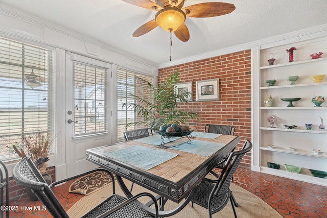 dining room with ceiling fan, crown molding, and built in features