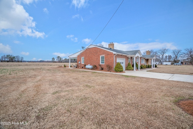 view of property exterior with a yard and a garage