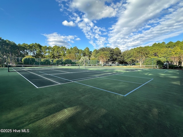view of sport court with fence