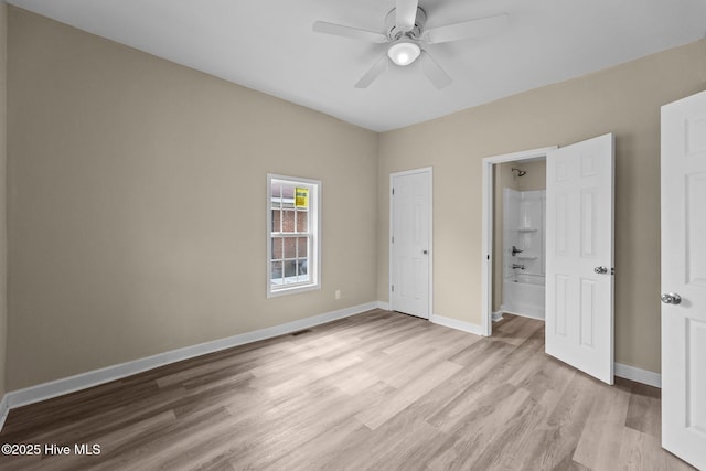 unfurnished bedroom featuring a ceiling fan, light wood-type flooring, visible vents, and baseboards