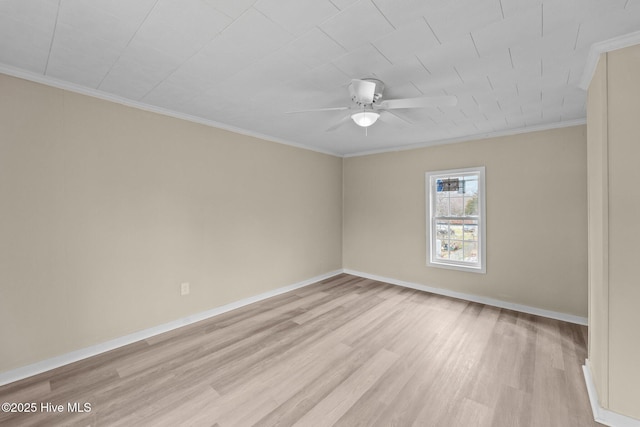 spare room featuring ceiling fan, crown molding, light wood-style flooring, and baseboards