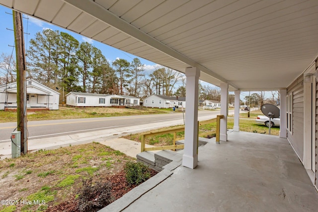 view of patio / terrace with a porch and a residential view