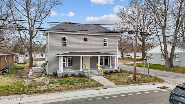 view of front of house featuring a porch and roof with shingles