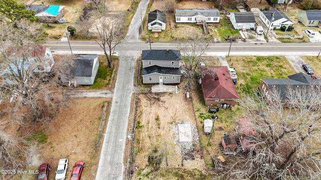 birds eye view of property with a residential view