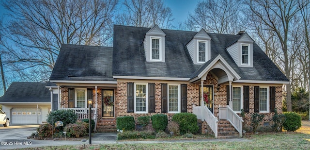 cape cod home with a garage